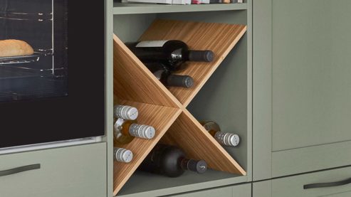 Einbauküche Nobilia® aus Holz in Grün nobilia® Einbauküche Frame mit JUNKER Geräten und  Ansetztisch olivgrüne Holzstruktur & Endgrain Oak - zweiteilig