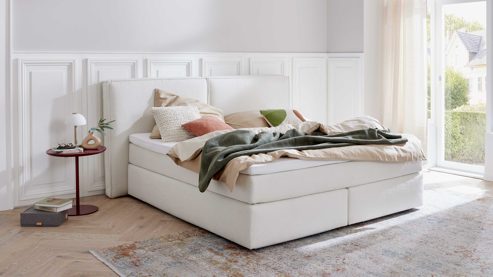 Boxspringbett Interliving aus Stoff in Weiß Interliving Boxspring Bett Serie 1421 elfenbeinfarbener Bezug Alfor 101 - Liegefläche ca. 180 x 200 cm
