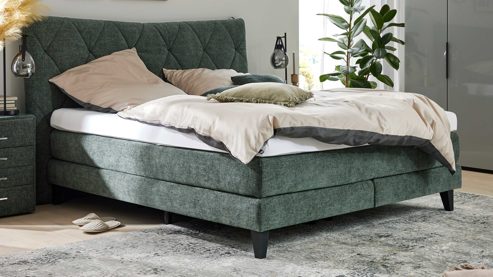 Boxspringbett Interliving aus Stoff in Grün Interliving Boxspringbett Serie 1420 moosgrüne Chenille Toni & schwarze Holzfüße - Liegefläche ca. 180 x 200 cm